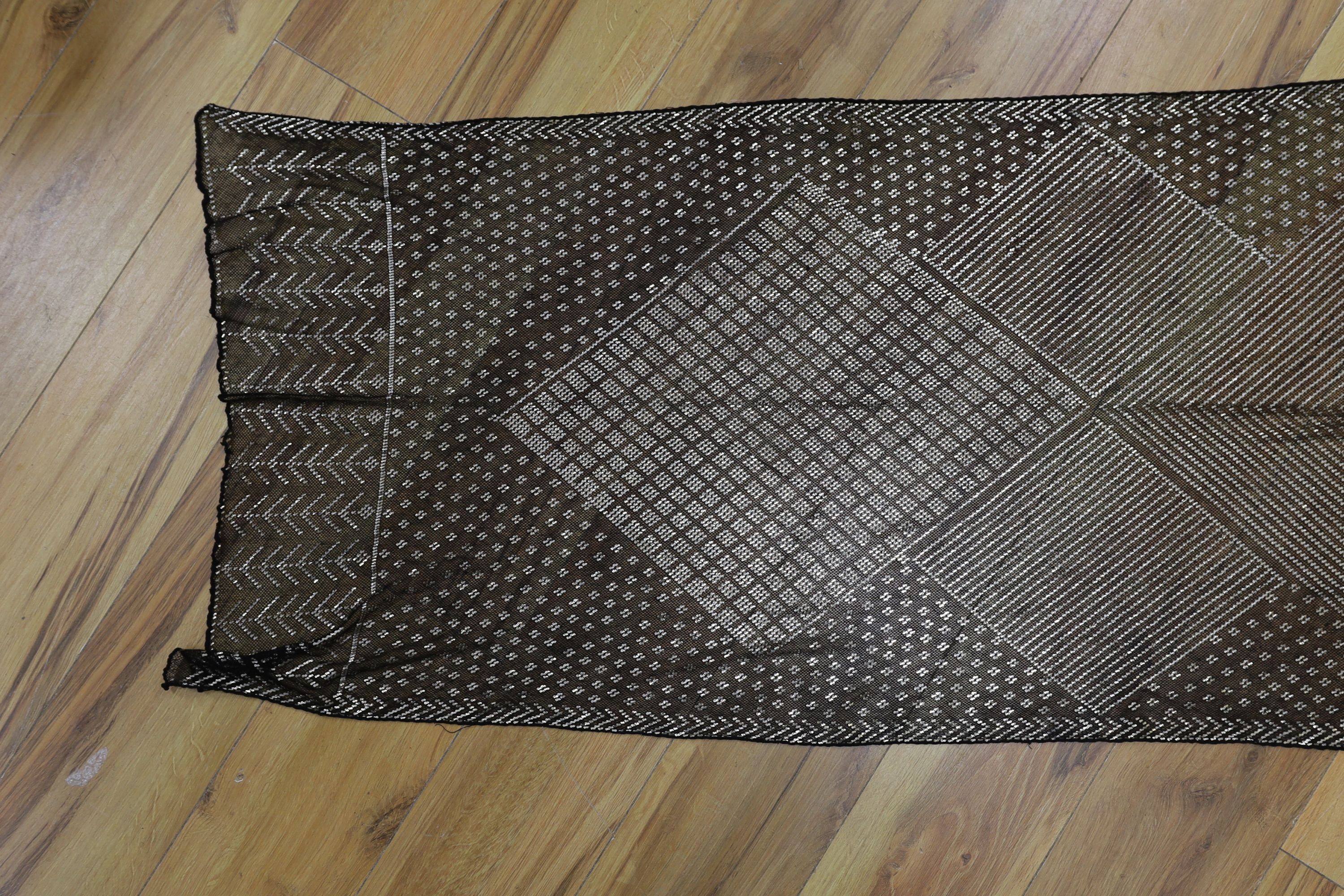 A dress made from a metal and black net Egyptian shawl; a similar shawl and a piece of shawl